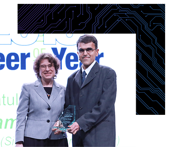 Vishram Pandit, 2019 Engineer of the Year, accepted the award from Naomi Price, Conference Content Director for DesignCon.