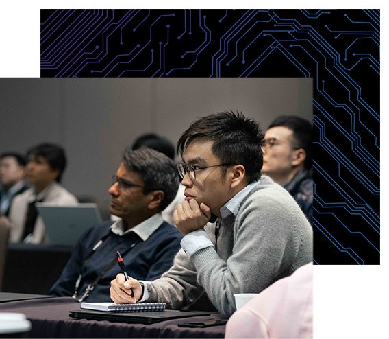 Attendees watching a conference session