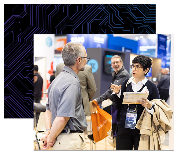 Woman asks a question to an exhibitor in the DesignCon expo hall.