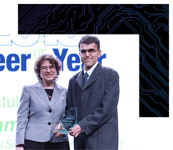Vishram Pandit, 2019 Engineer of the Year, accepted the award from Naomi Price, Conference Content Director for DesignCon.