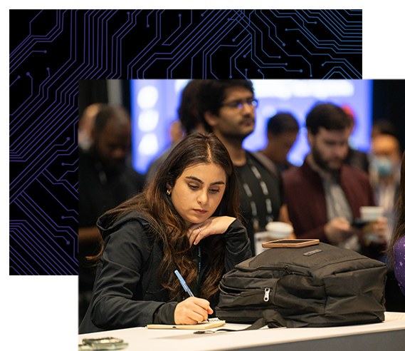 Attendee takes notes while listening to a speaker in the Chiphead Theater.
