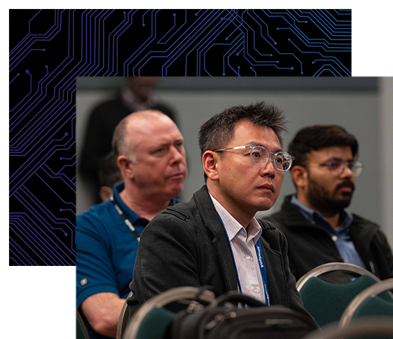 Conference attendee listens to a speaker at a session.